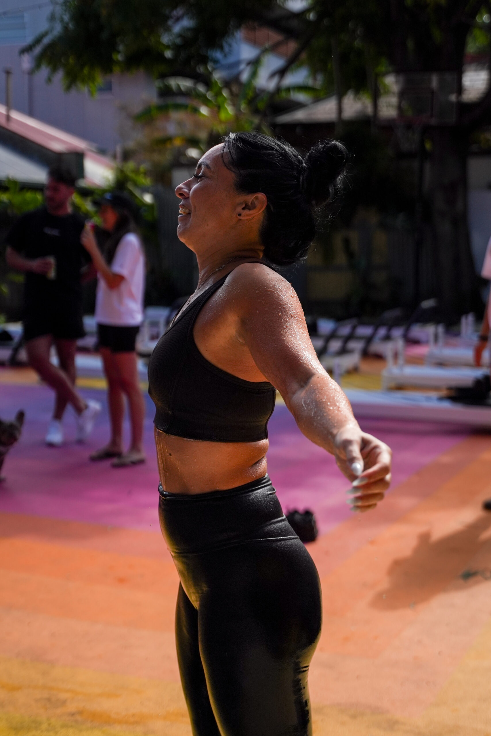 Woman stretching with her arms out after an ice bath